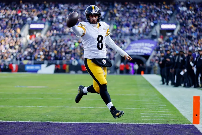 Dec 7, 2025; Baltimore, Maryland, USA; Pittsburgh Steelers quarterback Aaron Rodgers (8) scores a touchdown against the Baltimore Ravens during the first half at M&T Bank Stadium. Mandatory Credit: Peter Casey-Imagn Images