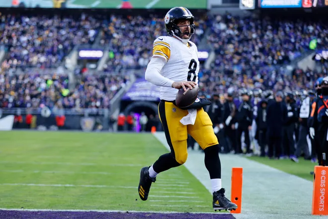 Dec 7, 2025; Baltimore, Maryland, USA; Pittsburgh Steelers quarterback Aaron Rodgers (8) scores a touchdown against the Baltimore Ravens during the first half at M&T Bank Stadium. Mandatory Credit: Peter Casey-Imagn Images