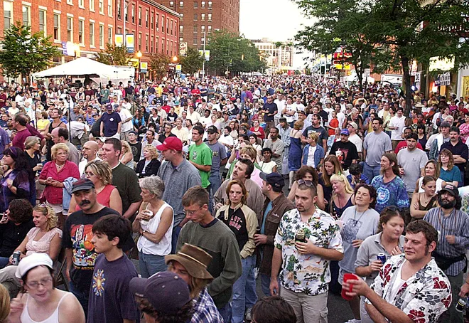 People turn out to watch the Allman Brothers Band perform on State Street in downtown Erie at CelebrateErie on Aug. 17, 2003.