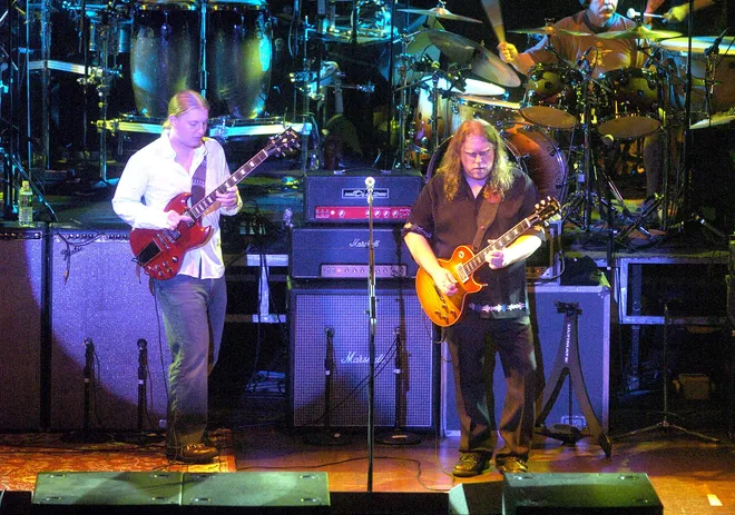 Derek Trucks, left, and Warren Haynes of the Allman Brothers Band perform at the Warner Theatre in Erie on July 19, 2005.