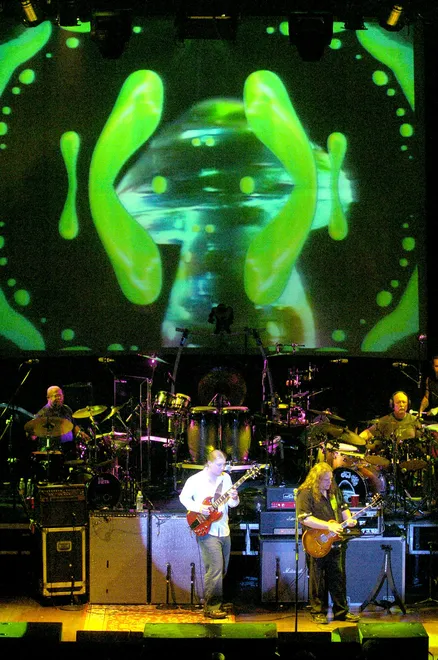 Derek Trucks, left, and Warren Haynes, right, perform with the Allman Brothers Band at the Warner Theatre in Erie on July 19, 2005, with drummers Jaimoe, left and Butch Trucks behind them. The show was later released as the two-CD live recording, " Warner Theatre, Erie, PA 7-19-05 ."