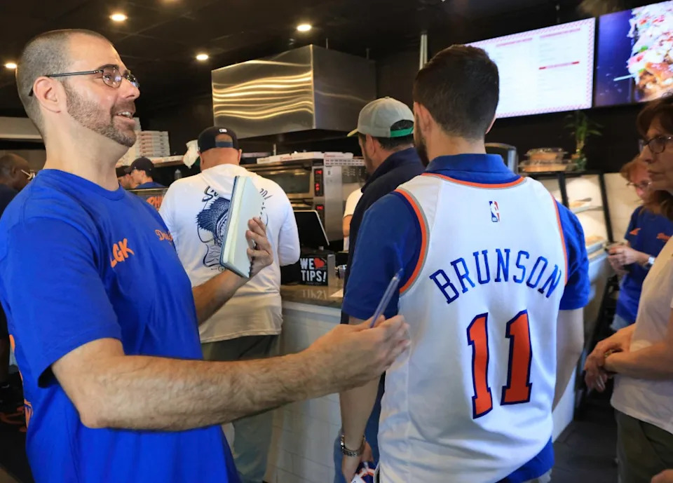 College professor Zachary Pournazari (in Brunson jersey) risked being late to a final exam to get his cheesesteak. James Messerschmidt for the NY Post