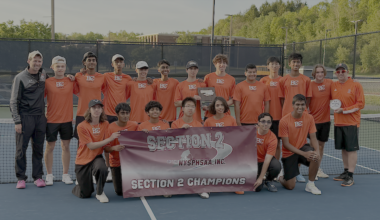 team picture holding banner