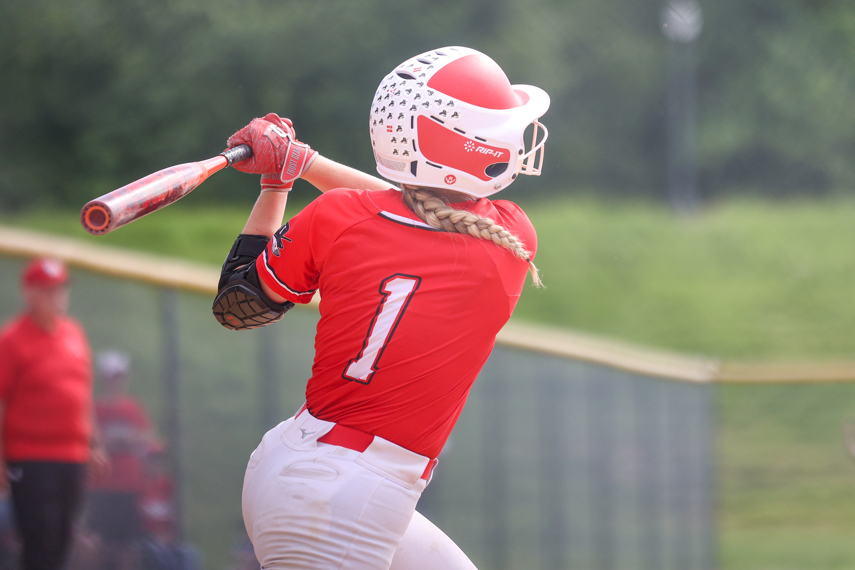 Williamsport’s Kinsley Cannode (1) follows through with a home run...