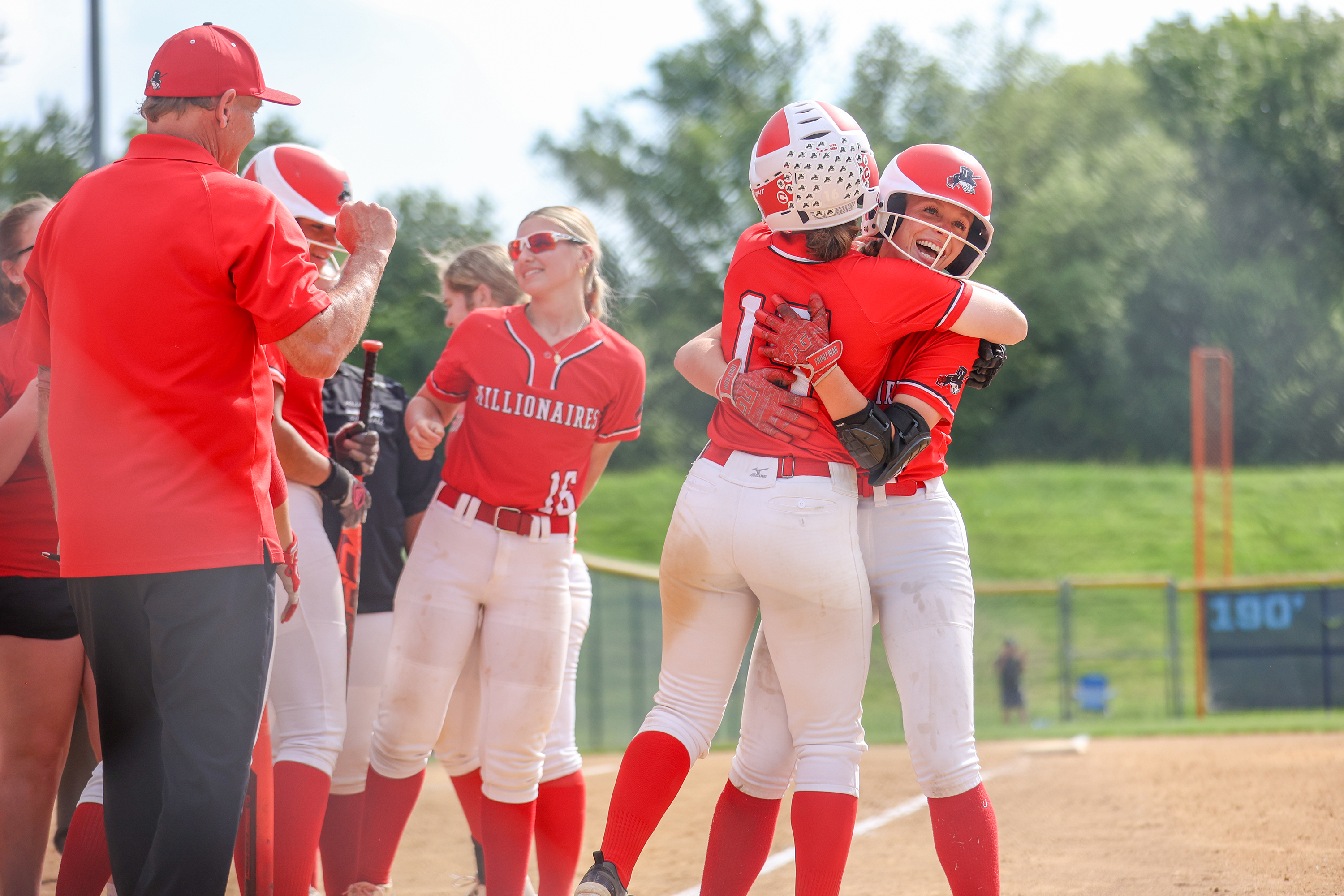 Williamsport celebrates after Kinsley Cannode hits a home run in...
