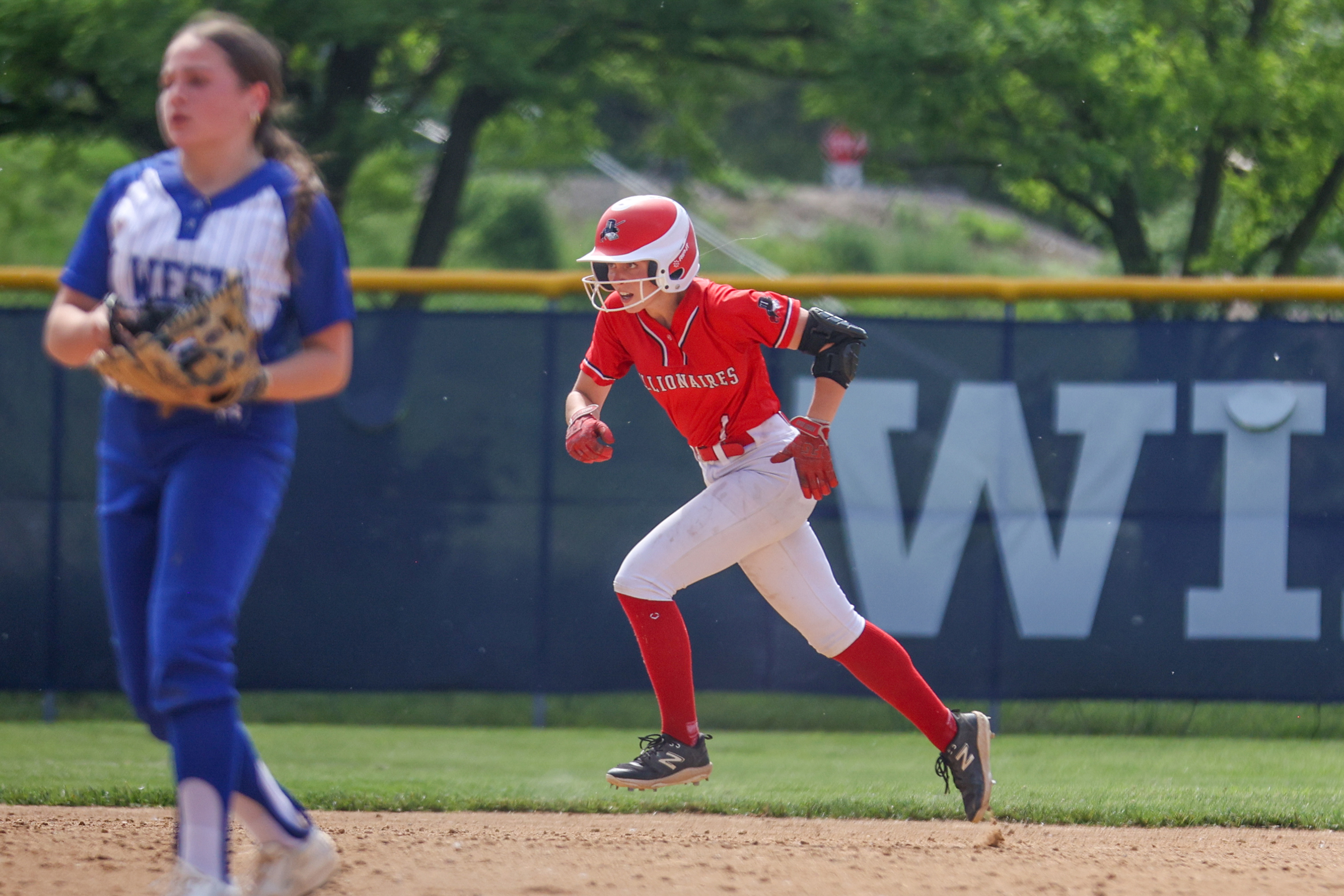 Williamsport’s Kinsley Cannode (1) advances to third on an error...
