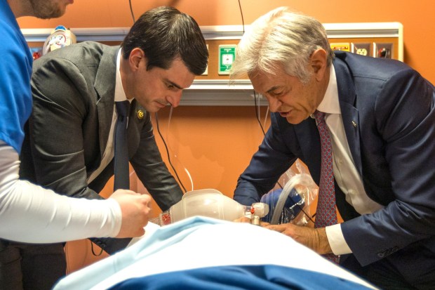 Pa. U.S. Rep. Rob Bresnahan, left, and U.S. Centers for Medicare and Medicaid Services Administrator Dr. Oz perform CPR on a dummy during a visit to Luzerne County Community College on Thursday, Feb. 26, 2026. (JASON ARDAN / STAFF PHOTOGRAPHER)