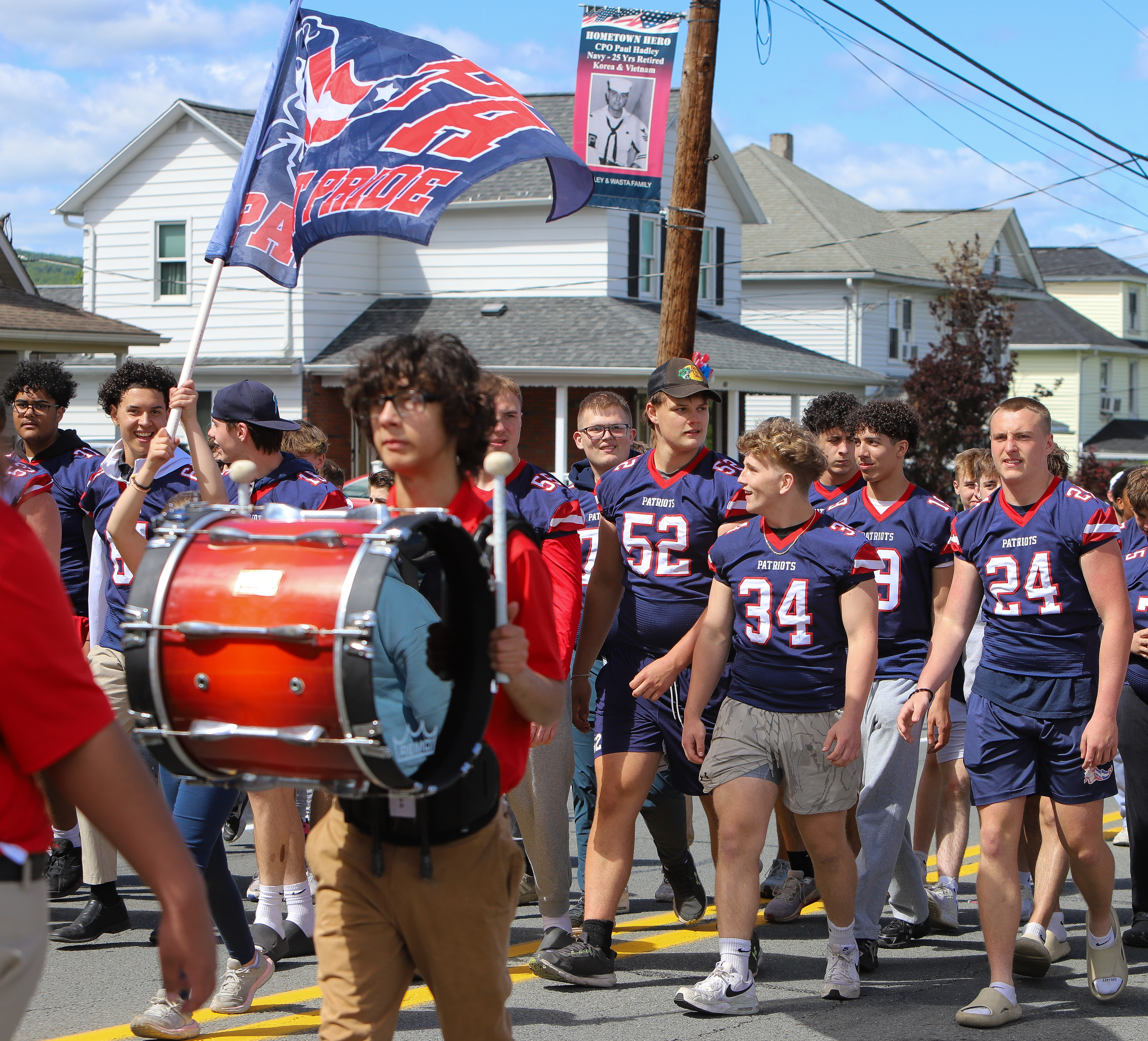 Members of the Pittston High School football team walk along...