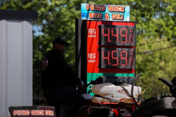 A man pumps gas at a 'Petro Quick' gas station in Berwick, Pa., on Tuesday, May 12, 2026. (JASON ARDAN / STAFF PHOTOGRAPHER)