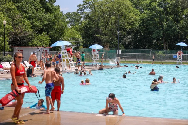 People gather at the Kingston Community Pool to cool off on a hot day on Tuesday, June 24, 2025. (JASON ARDAN / STAFF PHOTOGRAPHER)