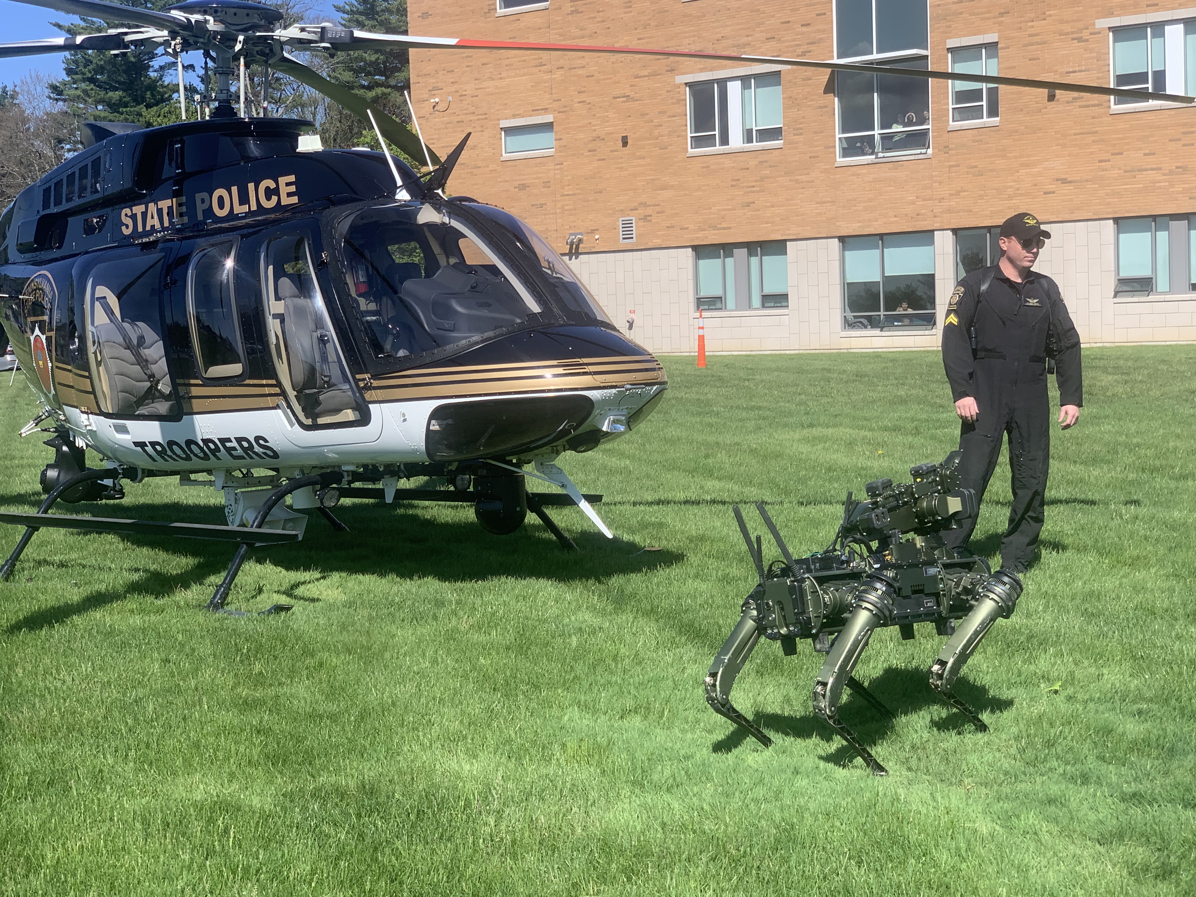 A Pennsylvania State Police helicopter, robot dog, and state trooper...
