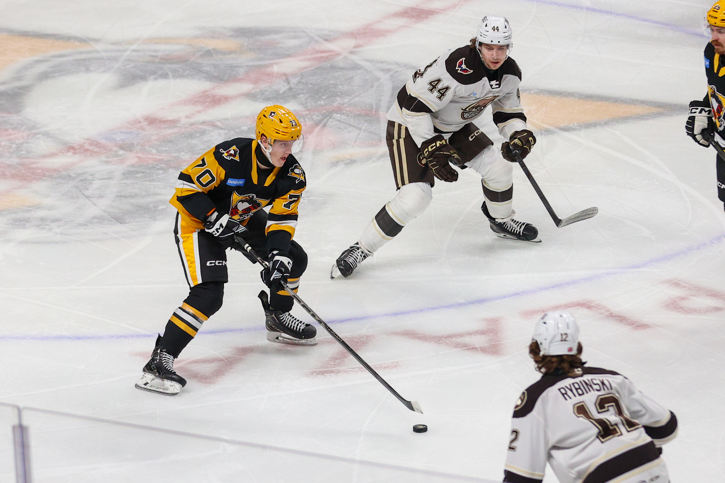 Wilkes-Barre/Scranton’s Mikhail Ilyin (70) takes the puck down the ice...