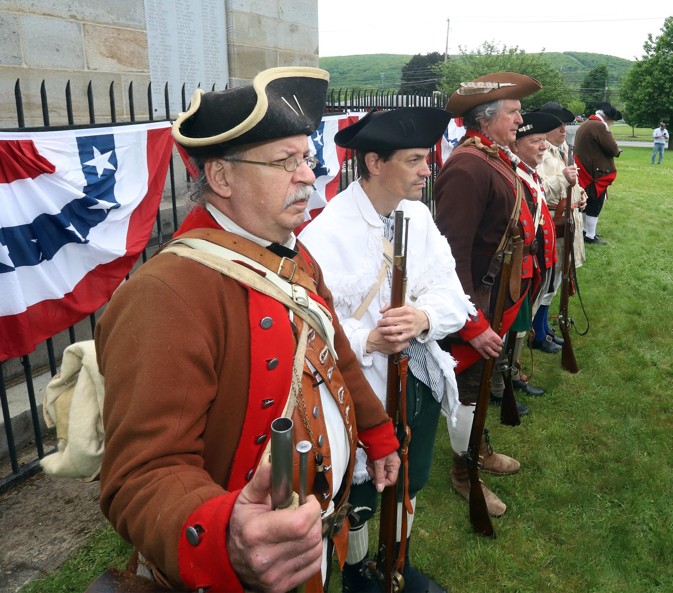Members of the 24th Connecticut Militia Regiment await orders to...
