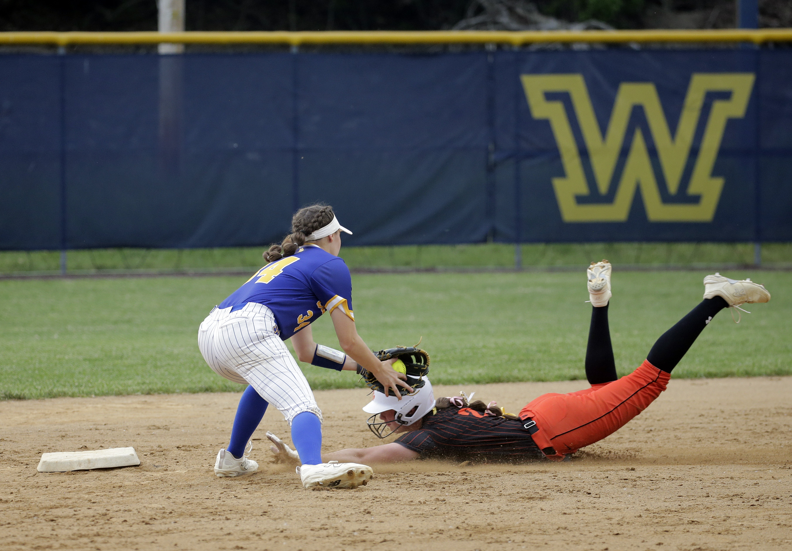 Valley View shortstop Cora Castellani, left, tags out Tunkhannock’s MaKenzie...
