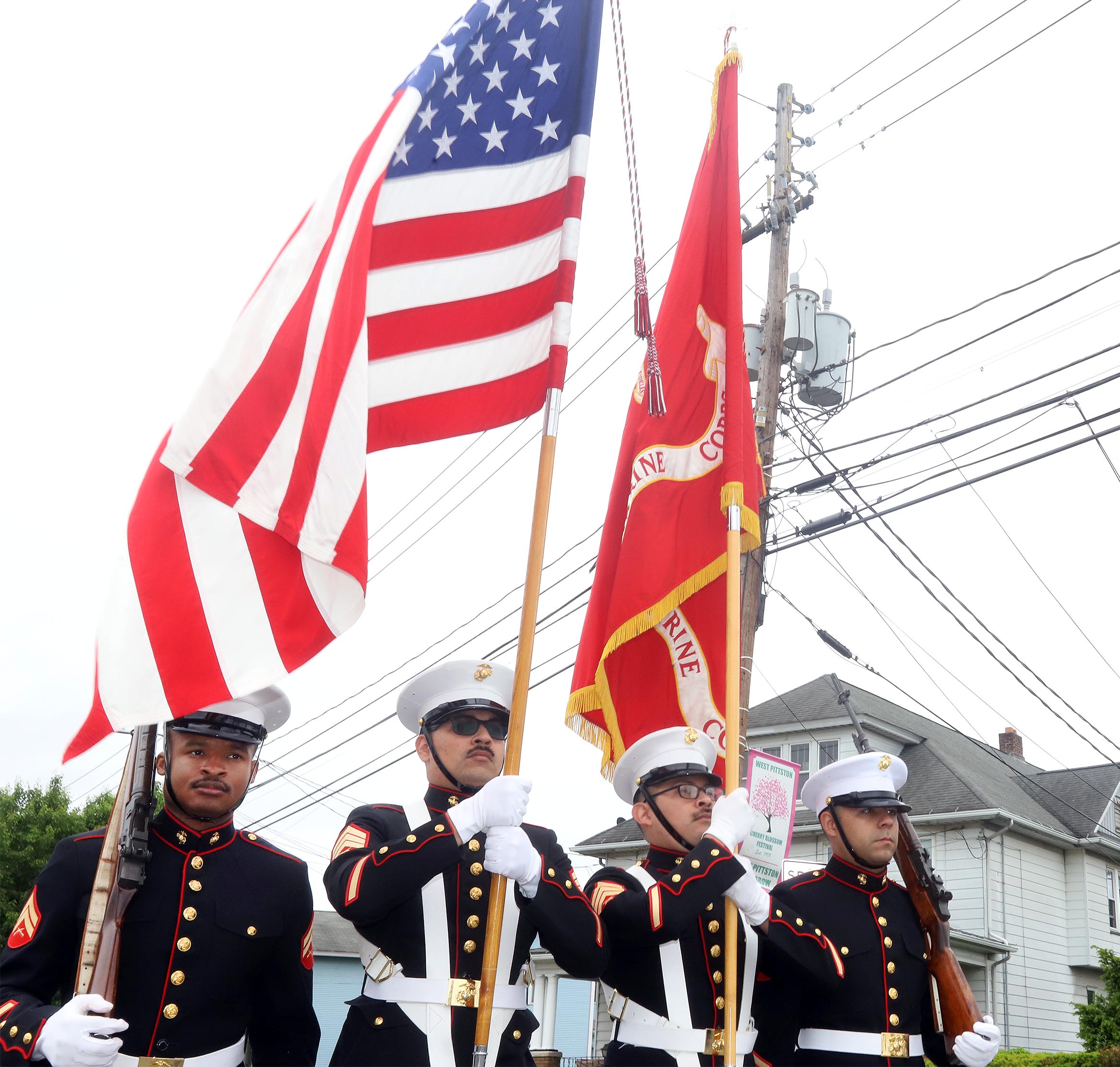 Members of The Marine Color Guard make their way along...