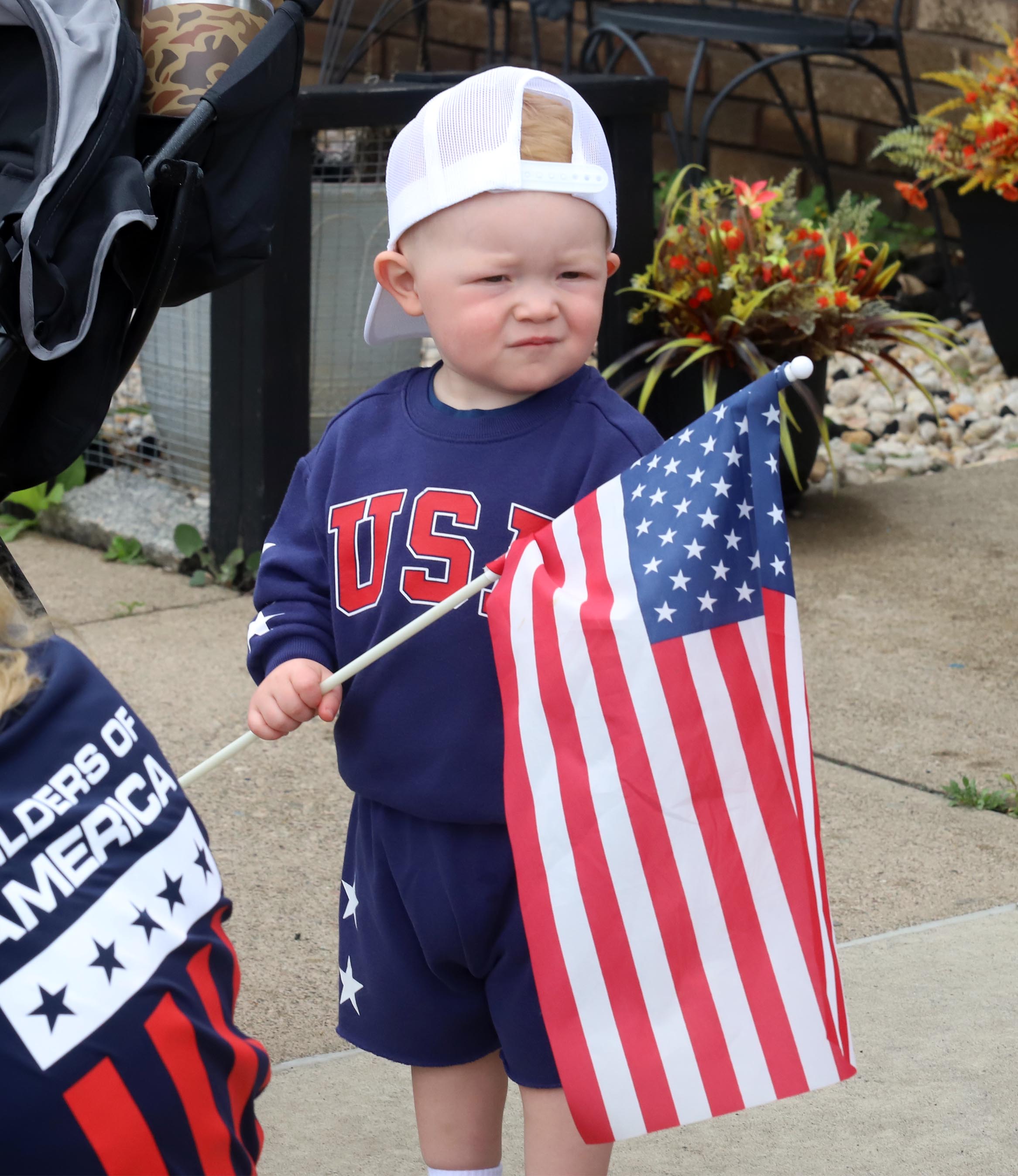 Two year old Beau Chrzan waits for the parade with...