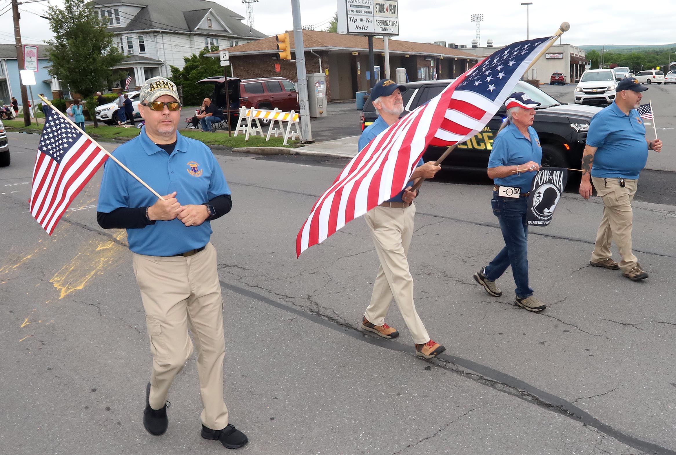 Members of The 109th Infantry Association make their way along...