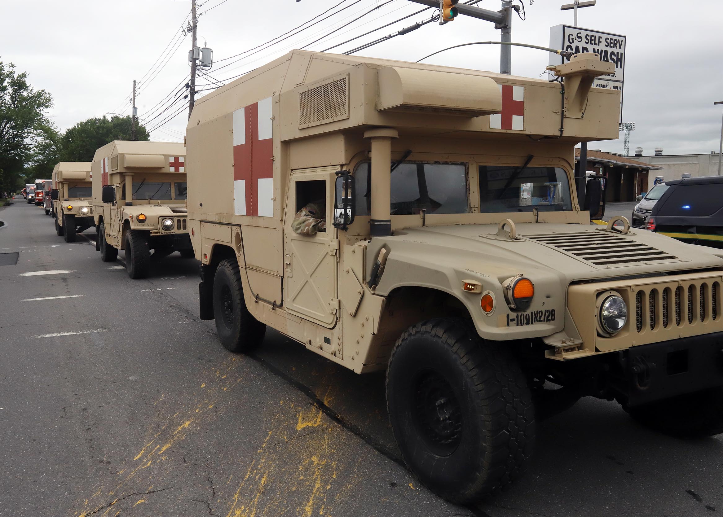Army Medic vehicles make their way along Wyoming Avenue during...