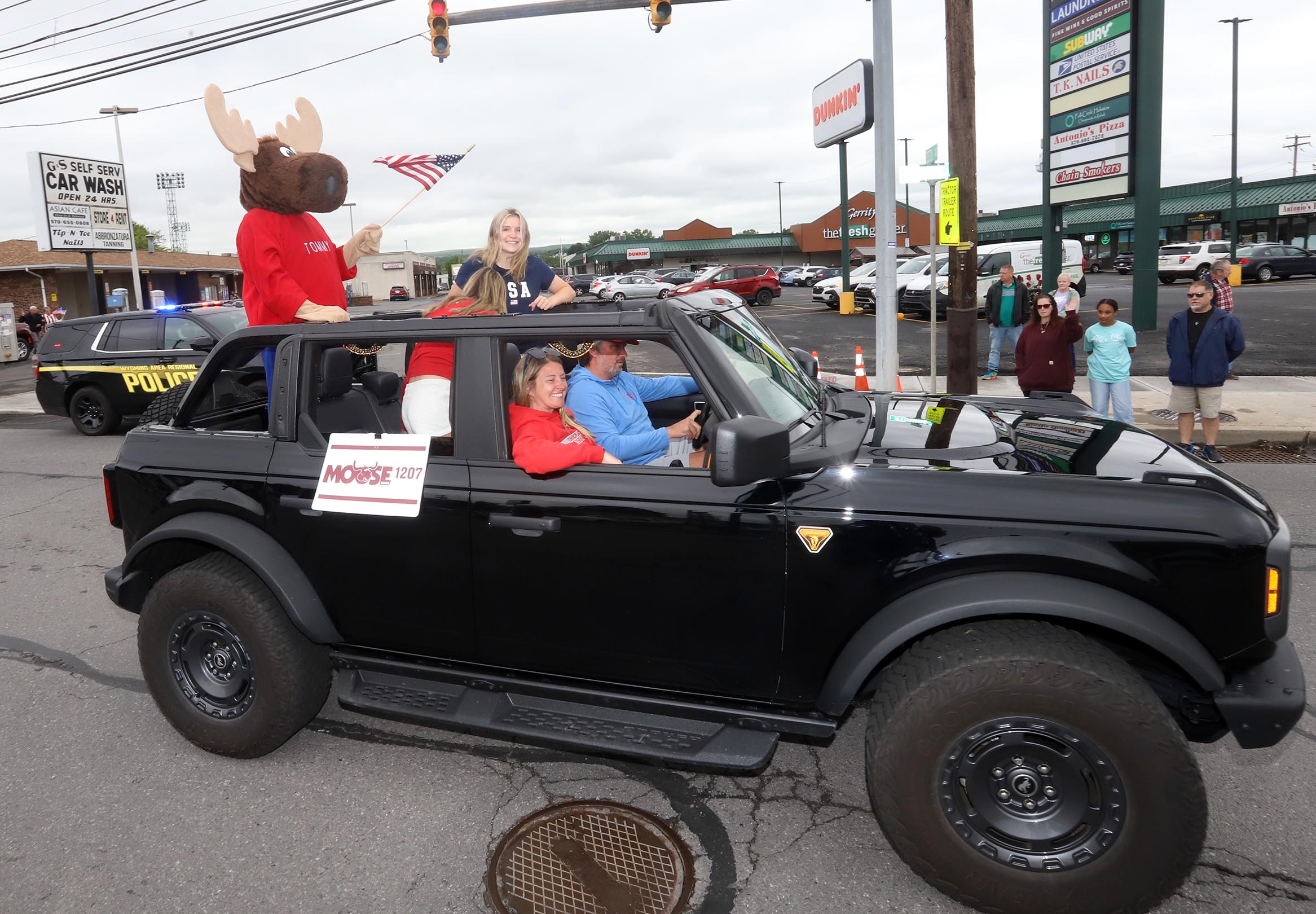 The West Pittston Moose Lodge vehicle make its way along...