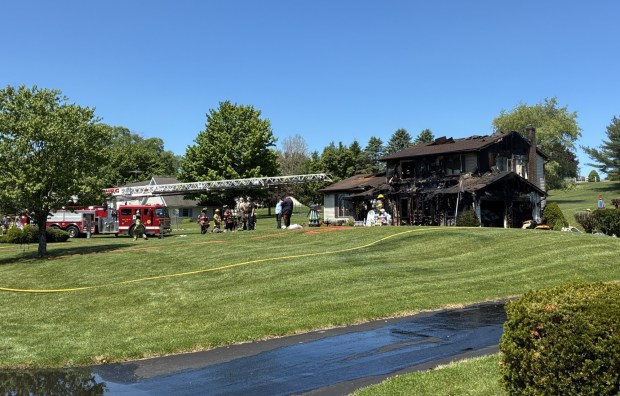 Fire crews battled a home fire on Archwood Drive in Centre Township on Tuesday. (Susan E. Miers Smith - Reading Eagle)