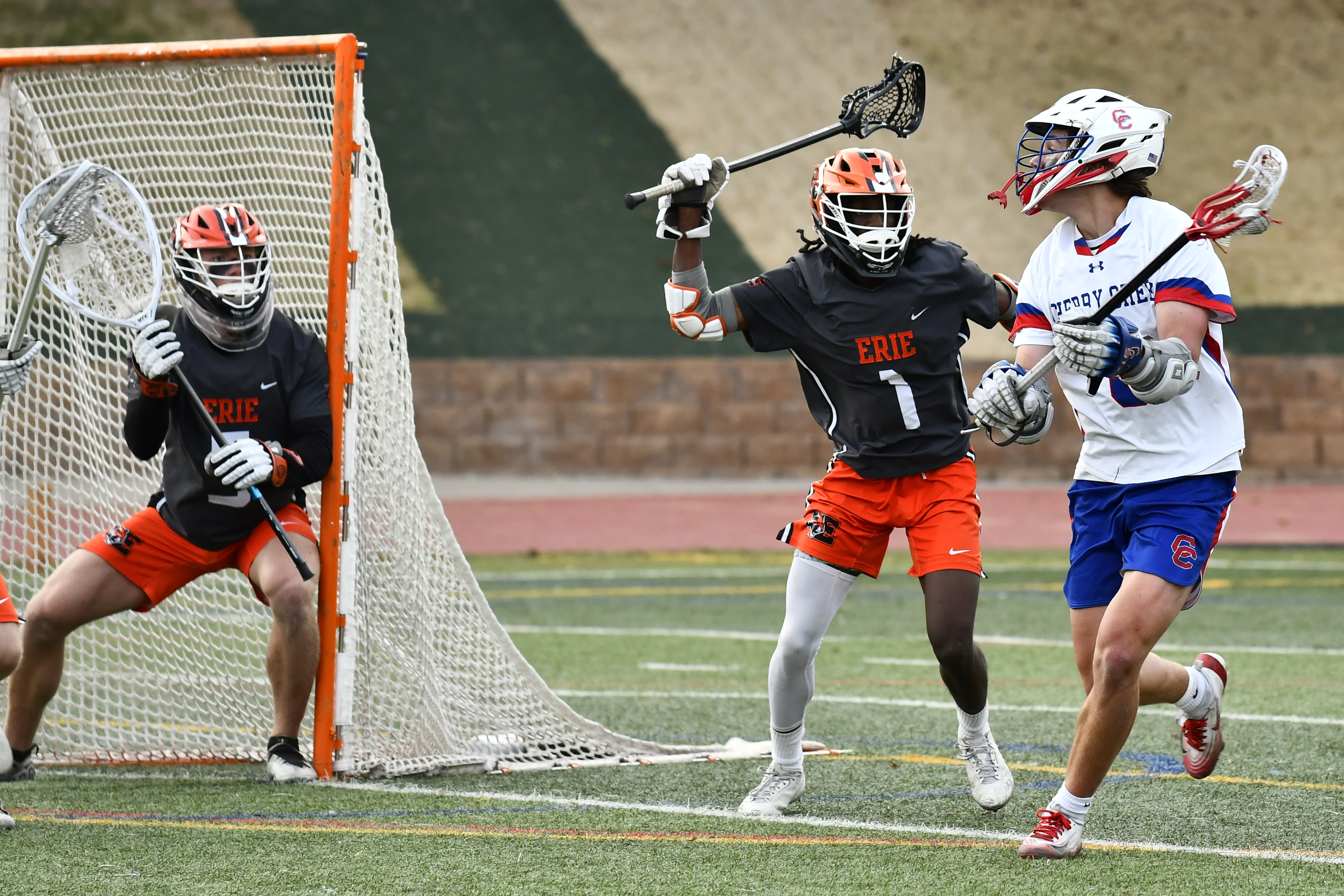 Erie's Jake McFann Kopp (1) defends the crease against Cherry...