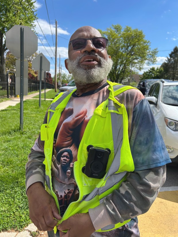 Albert Gilliard with his body worn camera. Gilliard, who has worked as a crossing guard in East Lansdowne for the past three years, said he has experienced run-ins with motorists who are annoyed at having to stop. (PETE BANNAN-DAILY TIMES)
