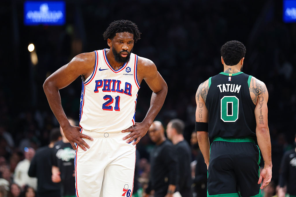 BOSTON, MASSACHUSETTS - APRIL 28: Joel Embiid #21 of the Philadelphia 76ers reacts against Jayson Tatum #0 of the Boston Celtics during the first quarter in Game Five of the First Round of the NBA Eastern Conference Playoff at TD Garden on April 28, 2026 in Boston, Massachusetts. NOTE TO USER: User expressly acknowledges and agrees that, by downloading and or using this photograph, User is consenting to the terms and conditions of the Getty Images License Agreement. (Photo by Maddie Meyer/Getty Images)