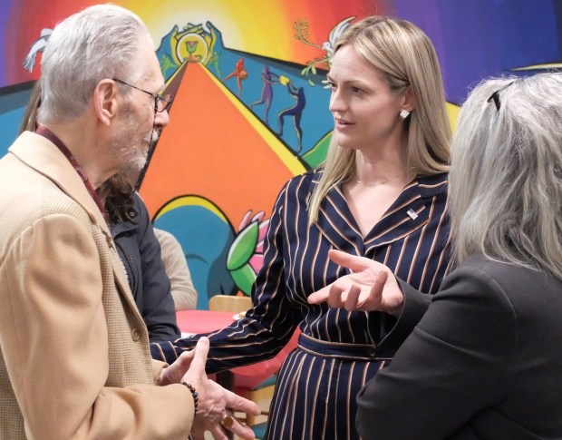 Scranton Mayor Paige Cognetti who running for the Pennsylvannia 8th congressional seat talks with people during the Community Dinner at the HIP Center in Hazleton on Friday May. 15 2026. The dinner is a partnership between Soul Kitchen and HIP and served more than 500 people during the event. (John Haeger / Staff Photographer)