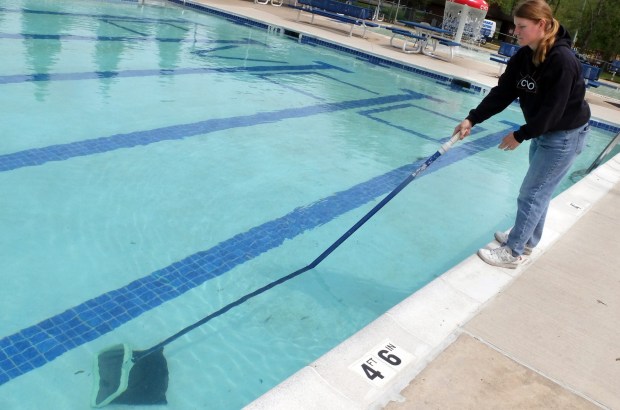 Lizzy McGran cleans the Conyngham Valley Civic Organization pool on Friday, May 22, 2026. (John Haeger / Staff Photographer)