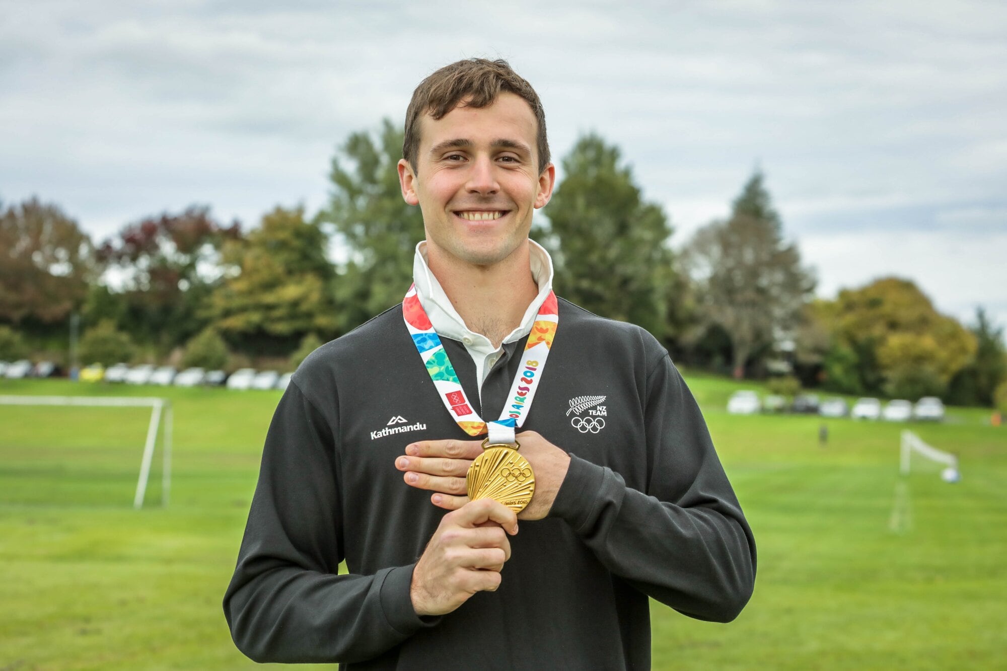Olympic discus thrower Connor Bell with his Olympic medal. Photo / Kelly O’Hara