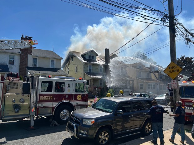 The Collingdale duplex on fire. (PETE BANNAN - DAILY TIMES)