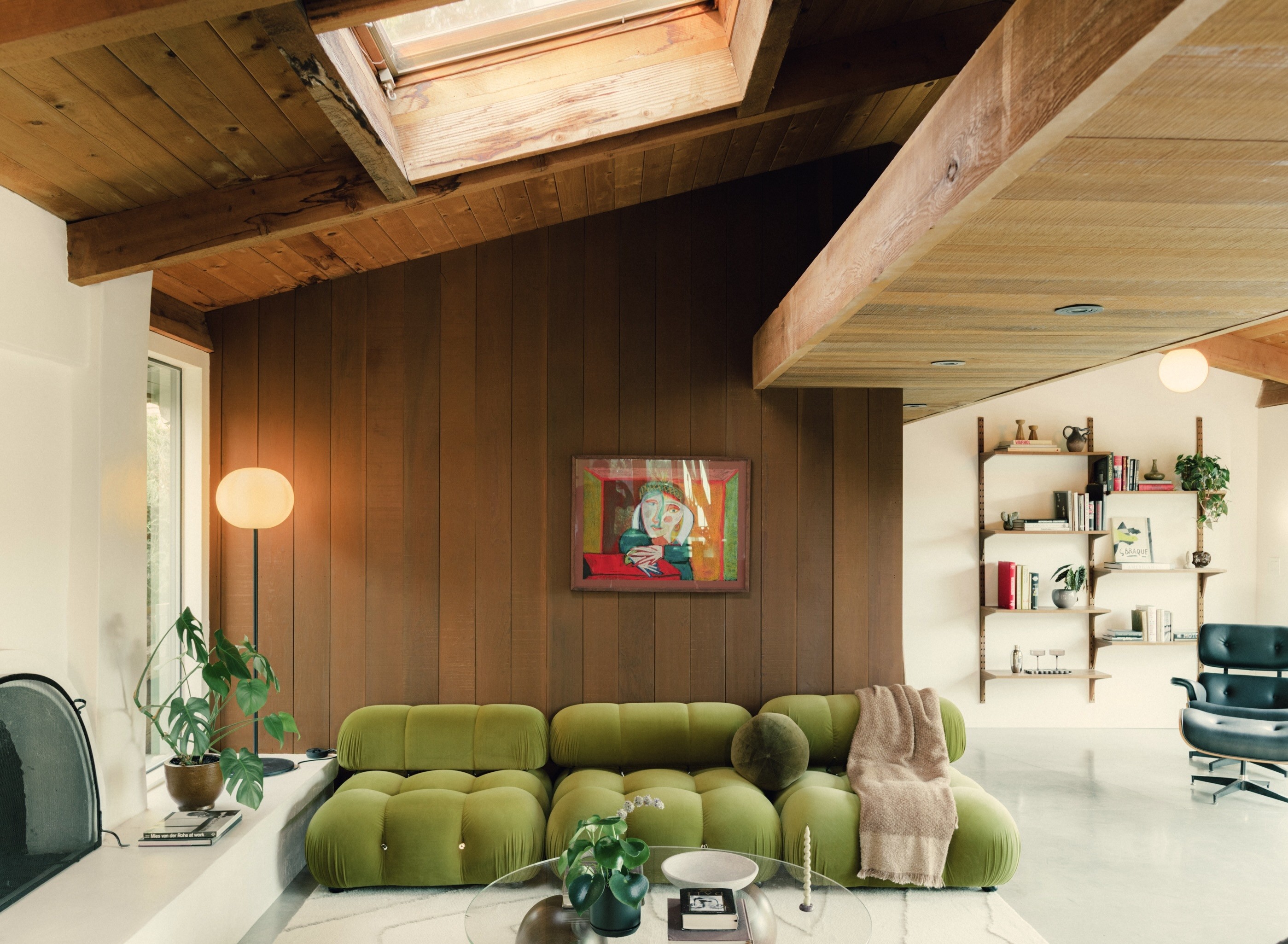 A circular fireplace anchors the living area. (Photo by Collin...