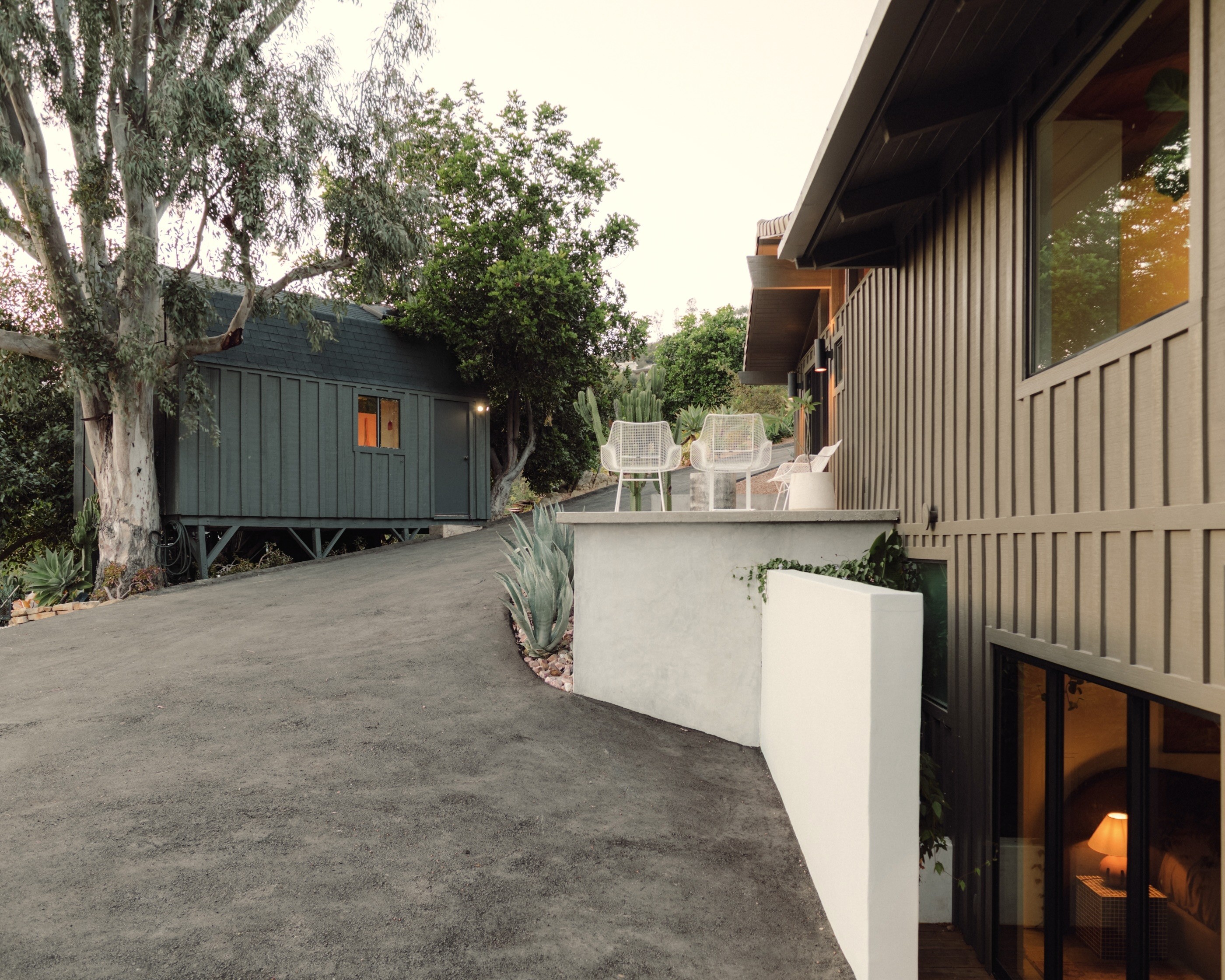 The studio sits across the driveway from the house. (Photo...
