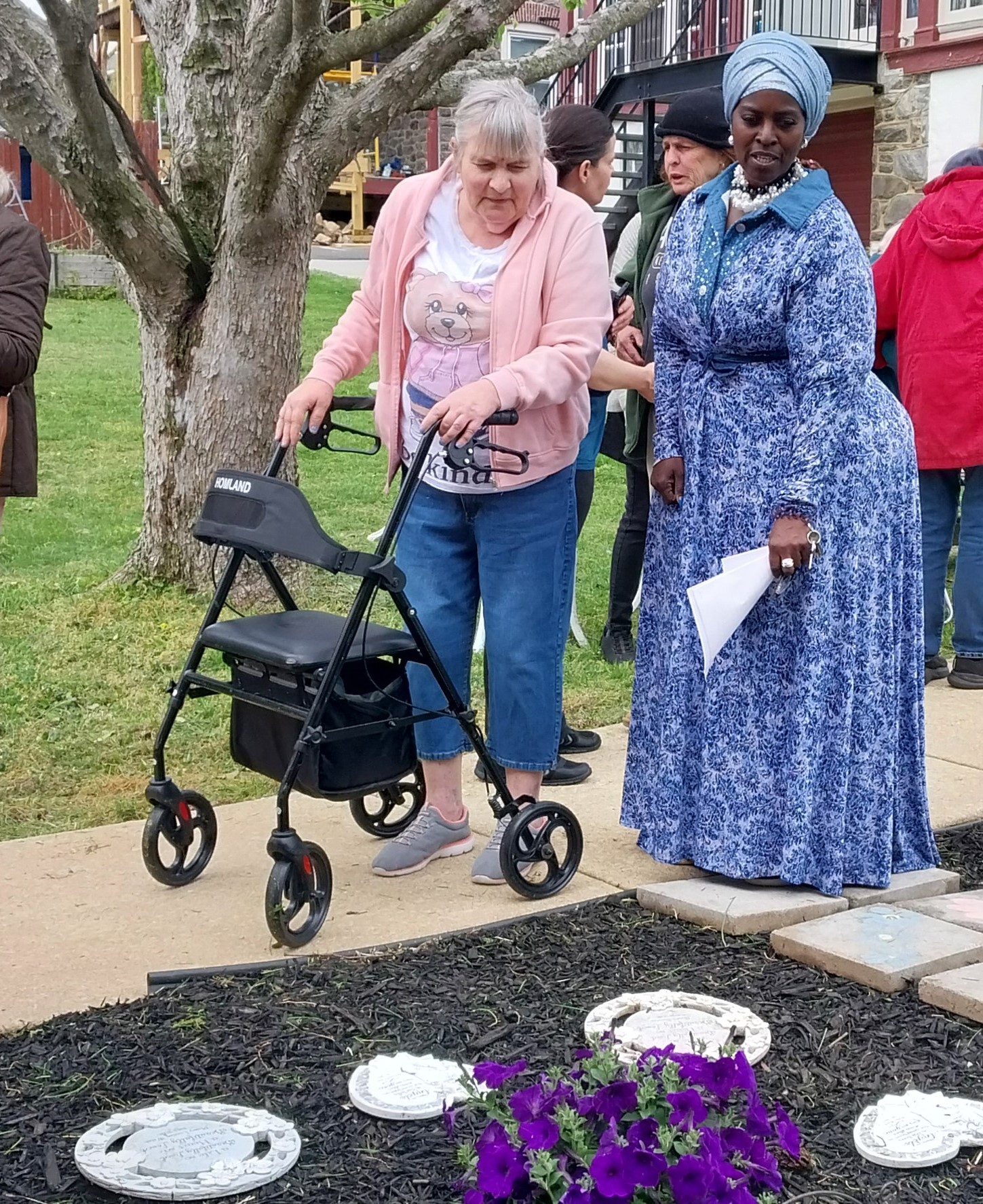 RHW Administrator Athenae Evans helps resident Carol Katona as they...