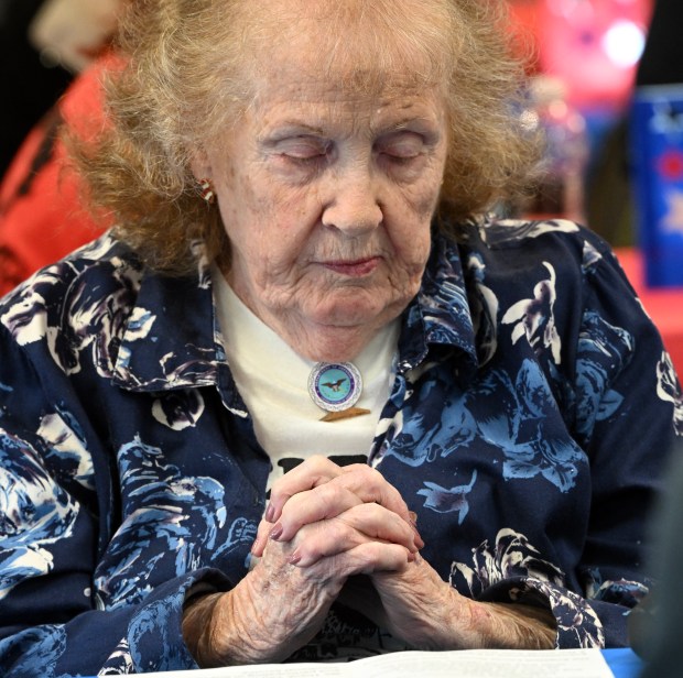Janet Angstadt Clouser, sister of Lt. Col. Ralph H. Angstadt who is Missing in Action in Vietnam, prays during a memorial dedication service on Saturday, May 9, 2026, at Friedens UCC in Oley. (BILL UHRICH/READING EAGLE)