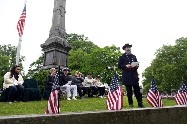 Mark Pflum of Wernersville, portraying Maj. L. Heber Smith of the 128th Pennsylvania Volunteer Regiment, reads the Gettysburg Address during Memorial Day services at the Civil War Memorial in Charles Evans Cemetery on Monday, May 25, 2026. (BILL UHRICH/READING EAGLE)