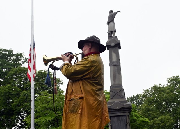 Richard Pawling of Gouglersville plays taps during Memorial Day services at the Civil War Memorial in Charles Evans Cemetery on Monday, May 25, 2026. (BILL UHRICH/READING EAGLE)