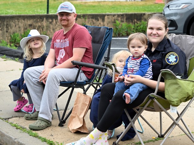 Tyler and Ashley Angstadt watch the parade with their children Ava, 7, Paisley, 4, and Blake, 1, at the 66th annual Mohnton Memorial Day Parade on Monday, May 25, 2026. (BILL UHRICH/READING EAGLE)
