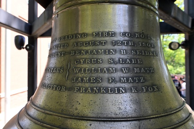 The bell from the original firehouse hangs outside the West Reading Fire Co. No. 1 125th anniversary and housing ceremony on Saturday, May 16, 2026, at 223 Playground Dr. (BILL UHRICH/READING EAGLE)