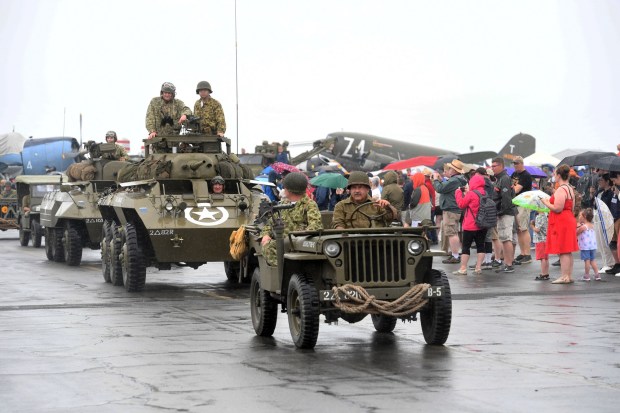 Vehicles parade in the rain during the World War II Weekend on June 7, 2025, at the Mid-Atlantic Air Museum in the Reading Regional Airport. (BILL UHRICH/READING EAGLE)