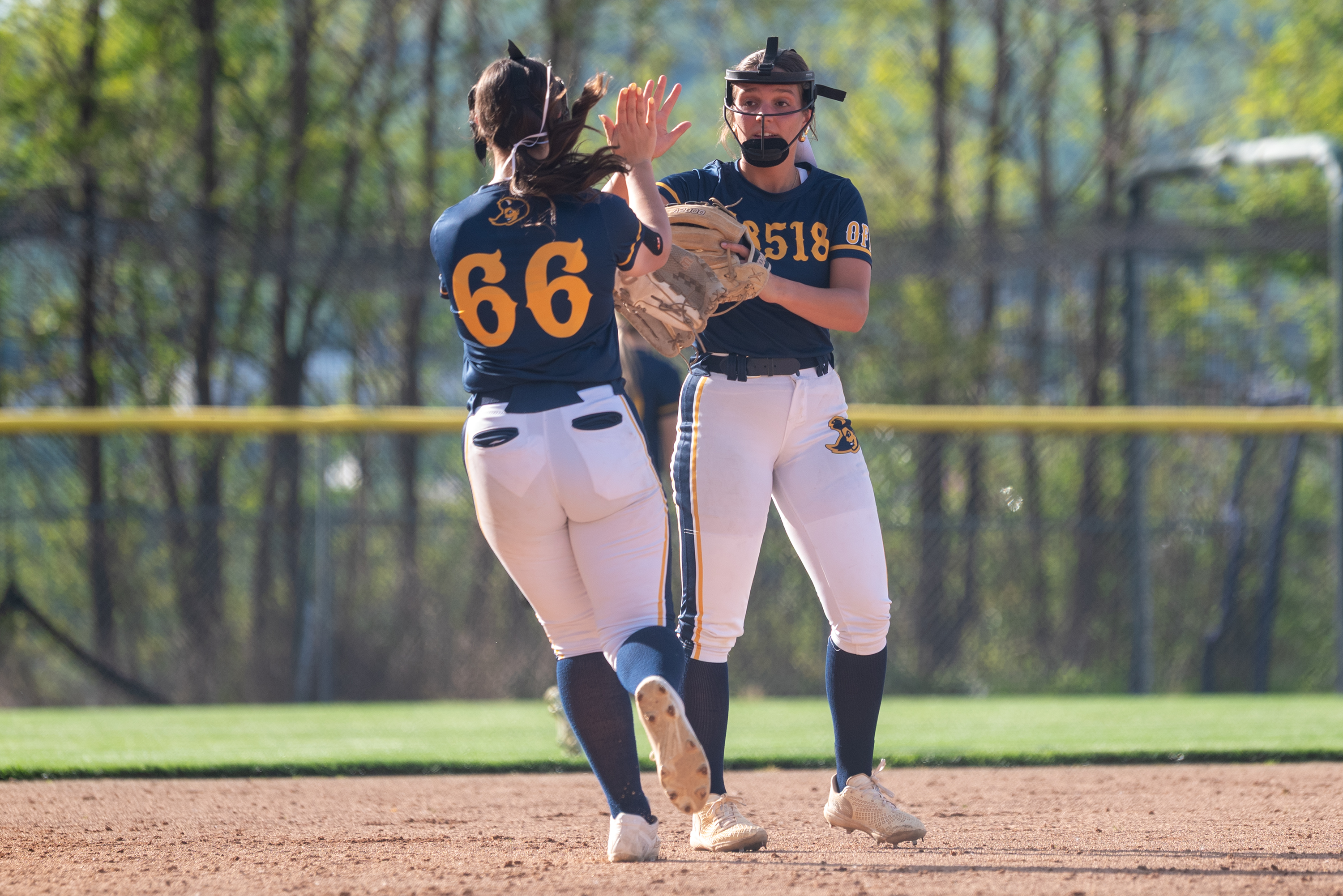 Old Forge’s Joselyn DeStefano high fives her teammate Lilianna Lenceski...