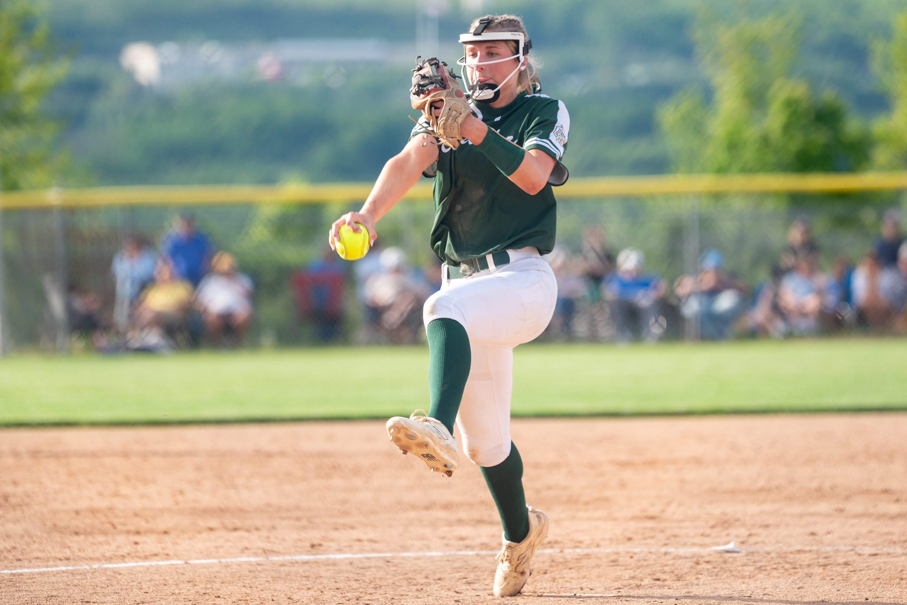 Holy Cross’ Ava Schmidt pitches during the District 2 Class...