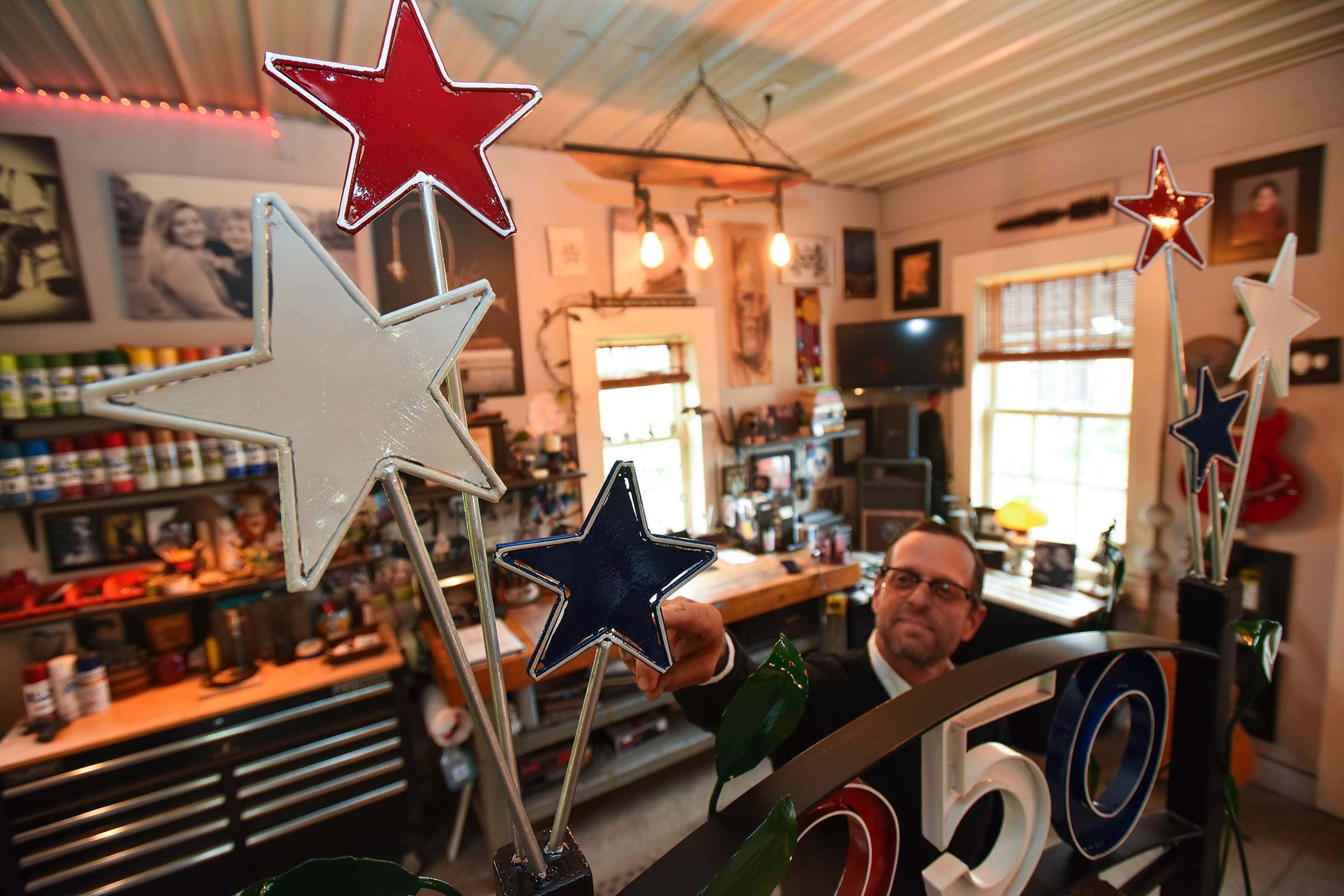 Scott Nichols points out the stars on top of the...