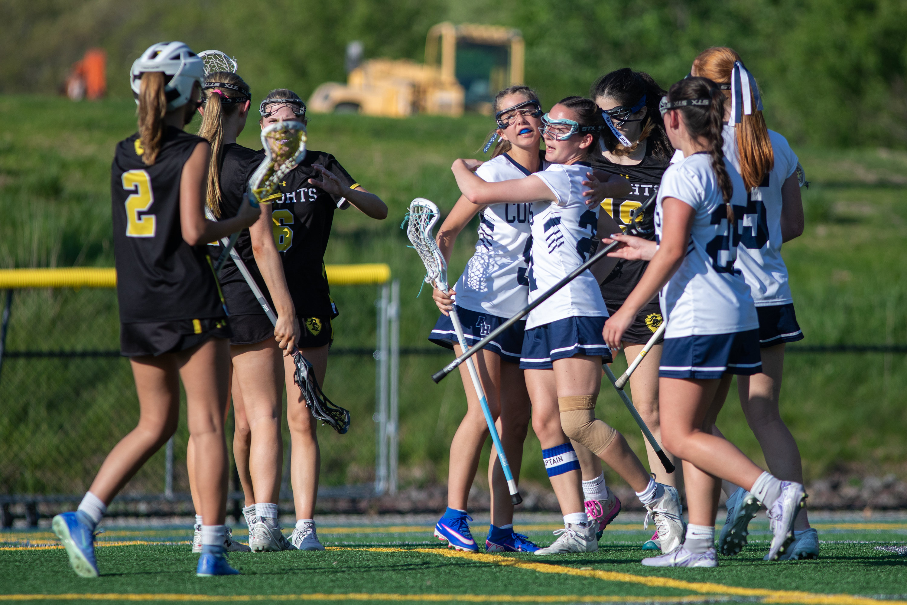 Abington Heights players celebrate after scoring during the lacrosse game...