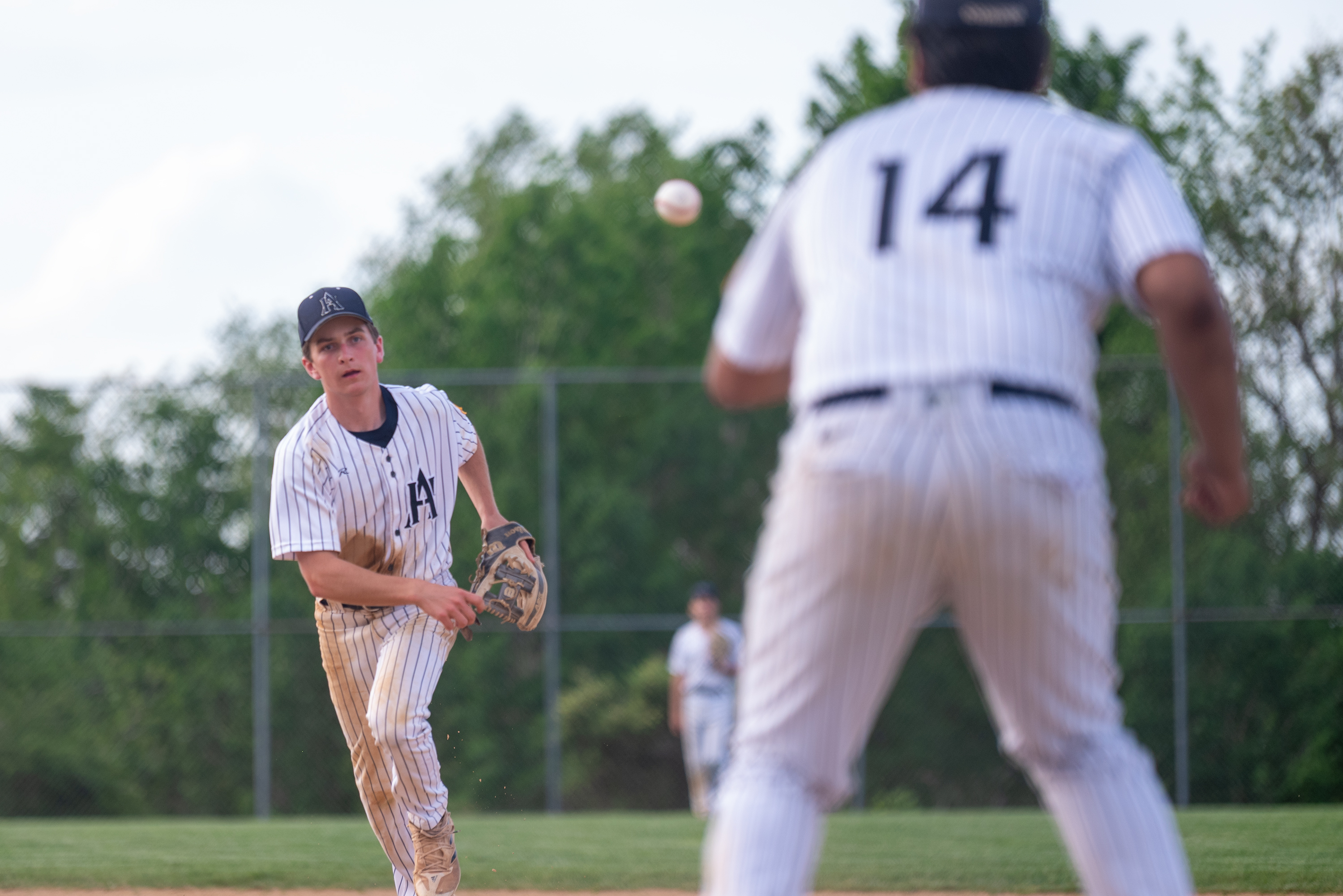 Abington Heights’ Cody Brown flips the ball to Harshal Patel...