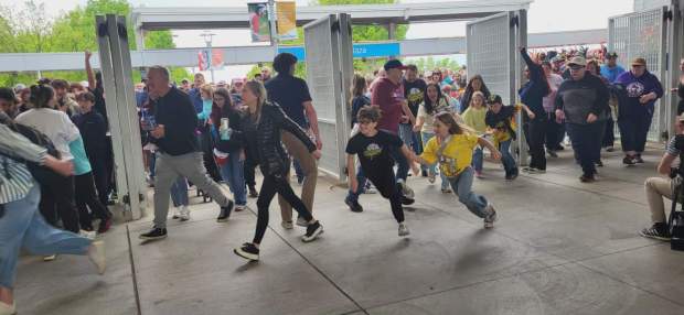 Banana Ball aficionados rush through the gates as soon as they opened at PNC Field on May 22, 2026, (GERI GIBBONS/STAFF PHOTO)