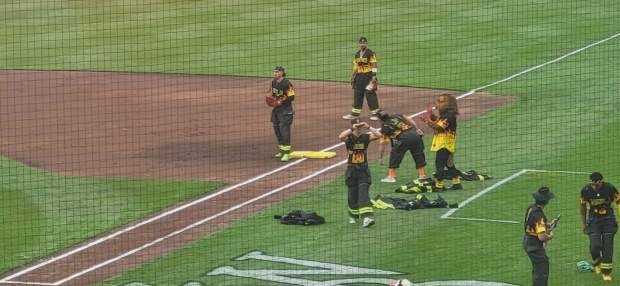 The Firefighters enter the field at the Banana Ball game on Friday, May 22, 2026. (GERI GIBBONS/STAFF PHOTO)