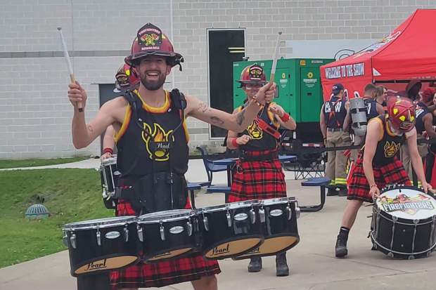 The Firefighters musical group delight the crowds at the PNC Field plaza prior to the game Friday .(GERI GIBBONS/STAFF PHOTO)