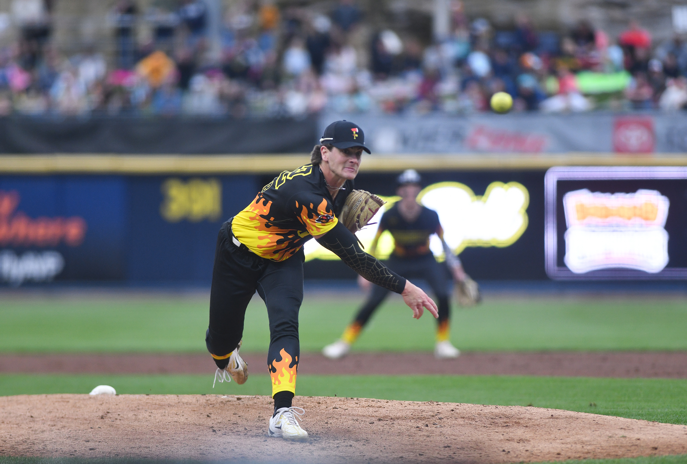 The Firefighters’ Bradford Webb releases a pitch against the Loco...