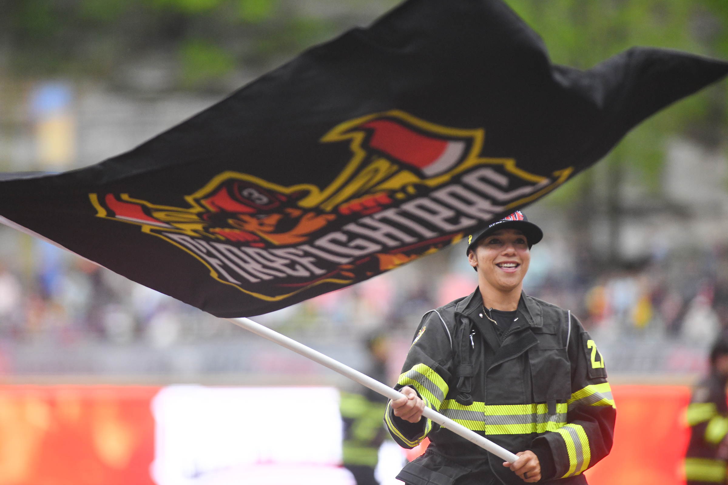 A member of The Firefighters team runs out with the...